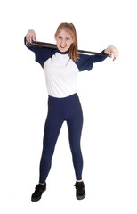 Woman holding her softball bat over her shoulder