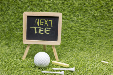 next tee sign on green course