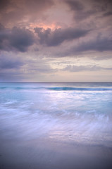 Fototapeta na wymiar Stormy Sunset and Ocean Beach