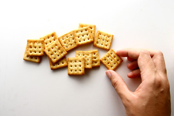 Cracker biscuit as wallpaper / A cracker is a baked food typically made from flour.