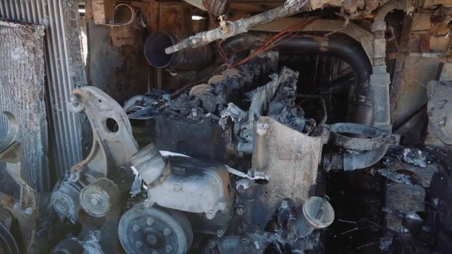 Detail of burnt engine of auto-bus