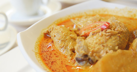 Eating spicy curry chicken