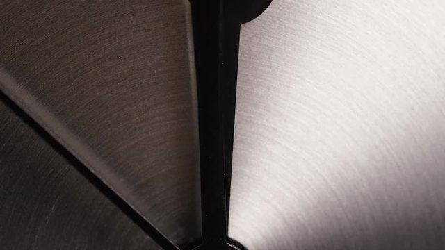 Clock face showing 12 o clock, in slow motion