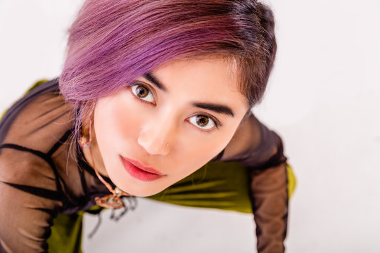 Asian woman looking up at camera