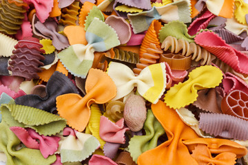 Multicolored italian pasta, horizontal background