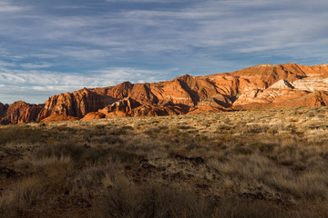 Wonderful sun lit red Navajo sandstone mountains in Snow Canyon State Park in Utah.