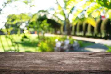 Empty wooden table in front of abstract blurred background of coffee shop . can be used for display or montage your products.Mock up for display of product.