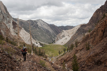 Fototapeta na wymiar A backpacker hiking on a trail in California. 