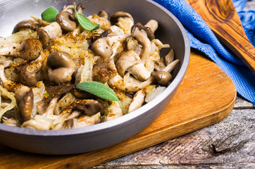 Fried oyster mushrooms with onions