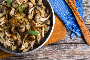 Fried oyster mushrooms with onions