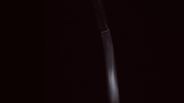 Knife flies and rotates on a black background. Close Up. Slow mo, slo mo, slow motion, high speed camera, 240fps, 250fps