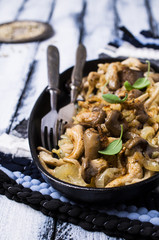 Fried oyster mushrooms with onions