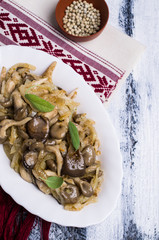 Fried oyster mushrooms with onions