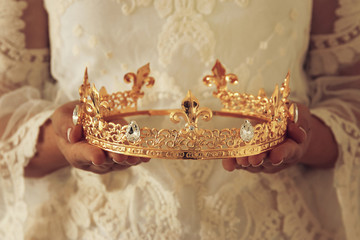 image of beautiful lady with white lace dress holding diamond crown. fantasy medieval period.