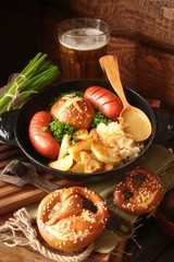 pretzels with sesame seeds and salt, fried cabbage, potatoes, shpikachki and beer