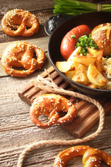 pretzels with sesame seeds and salt, fried cabbage, potatoes, shpikachki and beer