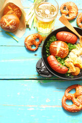 pretzels with sesame seeds and salt, fried cabbage, potatoes, shpikachki and beer