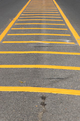 Yellow color road line on asphalt background