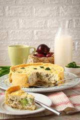 Homemade quiche with spinach, chicken and cream