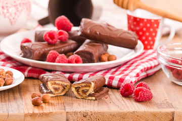 Chocolate rolls with hazelnuts and raspberries. 