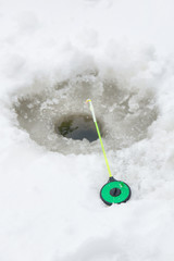 Tackle for winter fishing. Fishing rod on the ice.