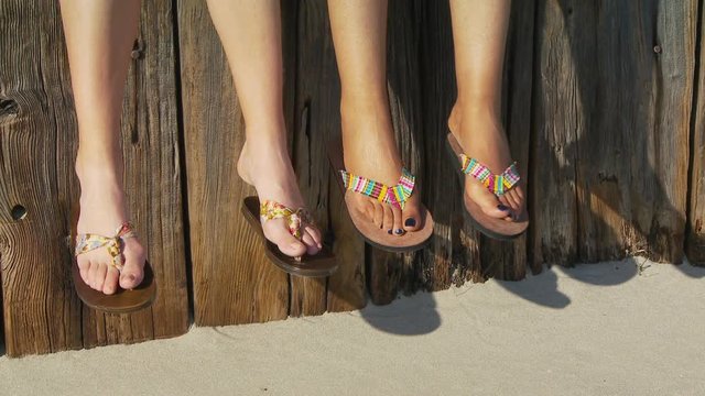 Close-up of women's feet in sandals