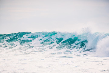 Ocean wave is crashing. Crystal wave in Bali