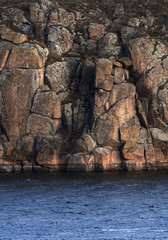 gloomy rocks overgrown with lichen