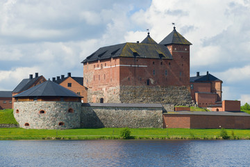 Fototapeta na wymiar Medieval fortress of Hameenlinna close up on a cloudy July day. Finland