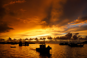 Home coming fishing boat at sunset in Kota Kinabalu in Sabah Malaysia - Powered by Adobe