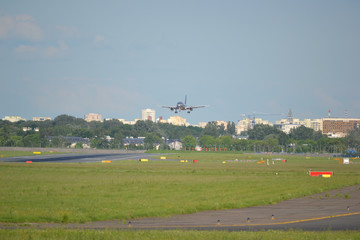 Fototapeta na wymiar Airplane landing on the airport