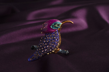 brooch bird with gems on silk