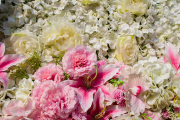 rose fake flower and floral background. rose flowers made of fabric. texture. Abstract background