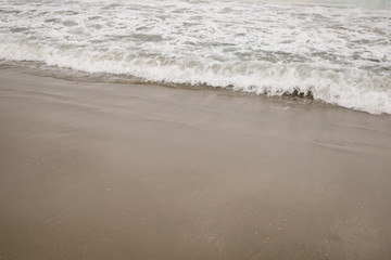 ocean waves on Santa Monica beach in cloudy november day