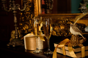 Two champagne glasses, Christmas gifts
