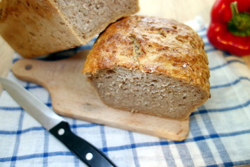 Fresh bread on cutting board in the kitchen