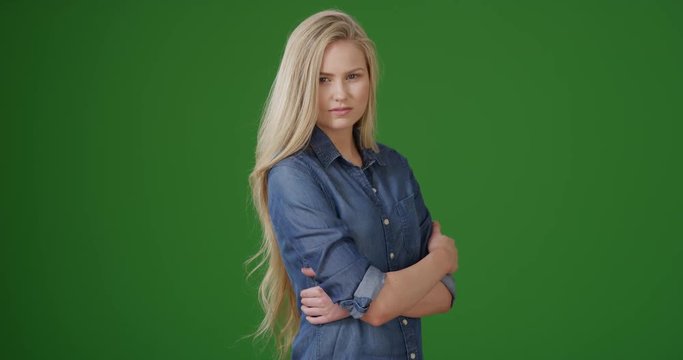 Beautiful young blond woman on green screen. On green screen to be keyed or composited.