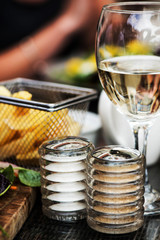 Basket of Fried Chips with a Glass of White Wine and Salt and Pepper