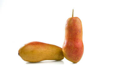 Two ripe pears are isolated on a white background.
