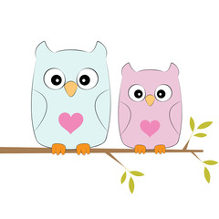 Two loving owls, happy birds are sitting on a tree.
