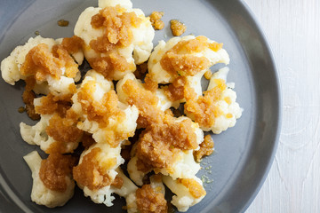 Vegetarian cooked cauliflower with bread crumb