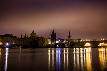 Fototapeta na wymiar Charles bridge in Prague with lanterns at night