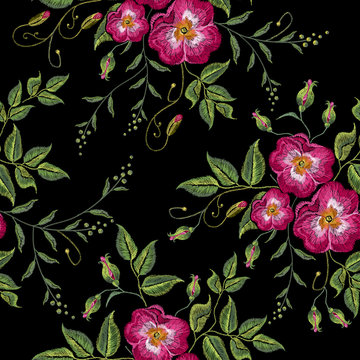 Classic style embroidery, beautiful roses flowers hand drawn pattern. Wild roses embroidery seamless pattern on a black background