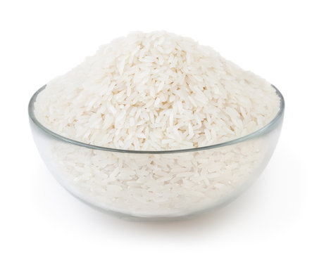 White long-grain rice in glass bowl isolated on white background with clipping path