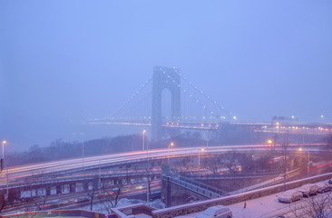 Fototapeta na wymiar George Washington Bridge in Snow Mist in lilac