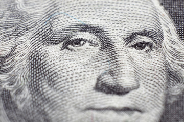 US president George Washington face portrait on the USA one dollar note with extreme macro