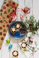 Fototapeta na wymiar Mincemeat pies. Christmas decorations. Cranberries. White background.