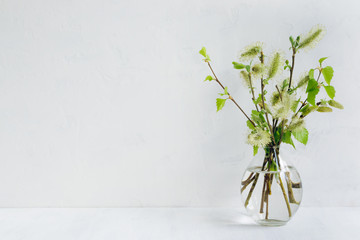 Spring bouquet with branches and green leaves