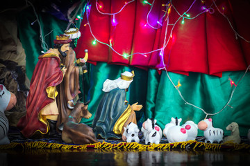 Christmas decorate figures including Jesus, Mary, Joseph, sheep.