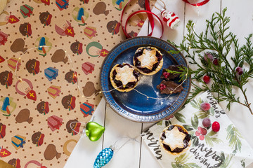 Mincemeat pies. Christmas decorations. Cranberries. White background.
